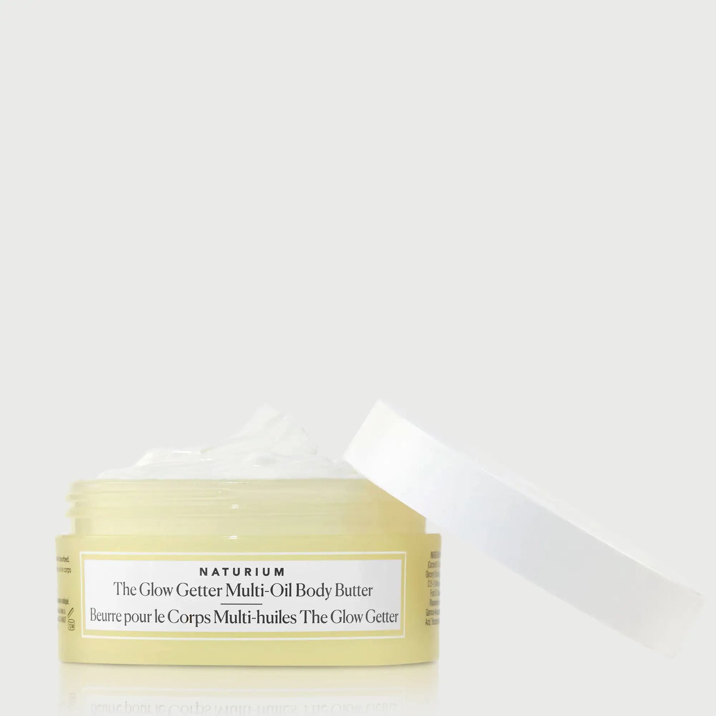 the-glow-getter-multi-oil-body-butter-travel-size-u5 NATR-40115_Glow-Getter-Body-Butter-Mini_front_capoff_bonebkgd.webp